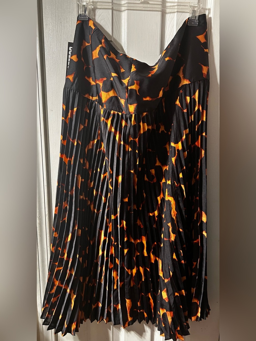 Pleated Maxi Skirt in Black with Orange Print